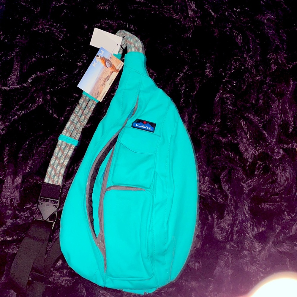 Kavu sling bag. New With Tags. Mint color